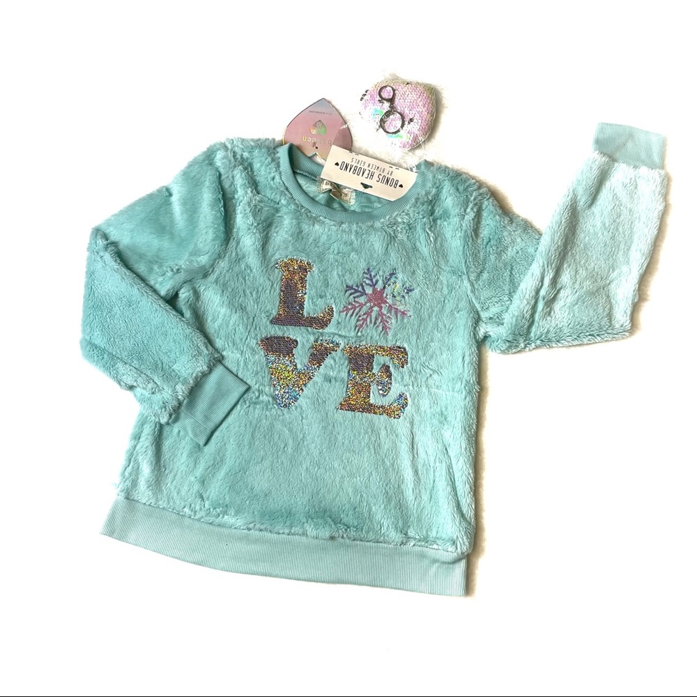 Between NWT fuzzy top with sequins appliqué